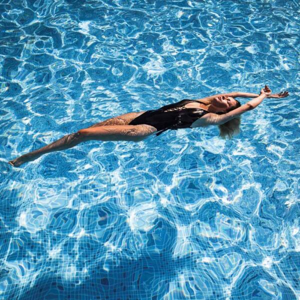Lady swimming on back in Geelong fibreglass swimming pool